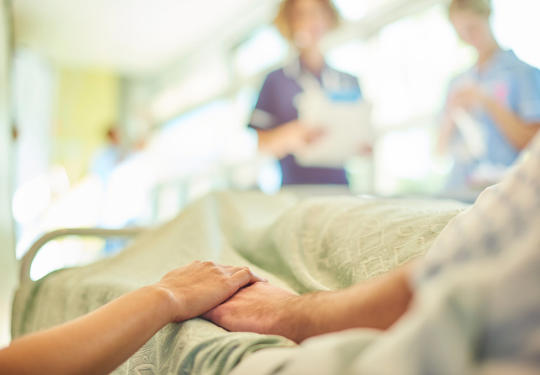 Patients Holding Hands