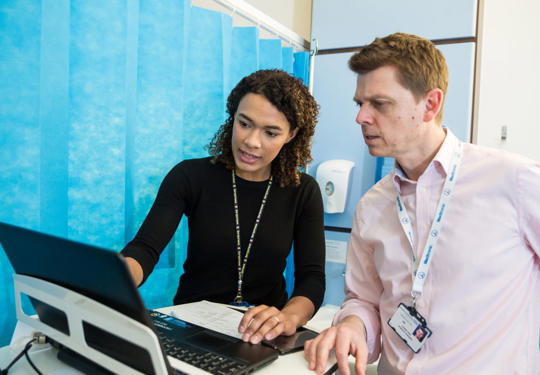 Doctors Working Together On A Ward