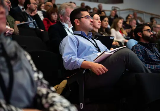 Attendees Watching Conference (1)